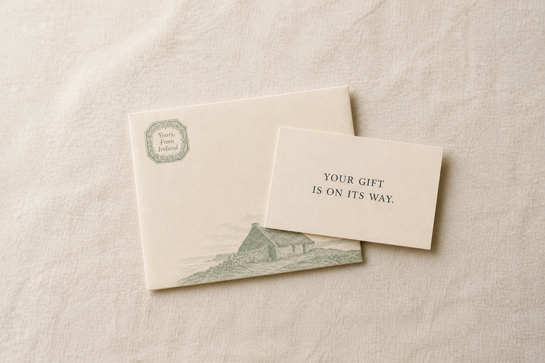 A printable gift card overlapping a Yours, From Ireland envelope